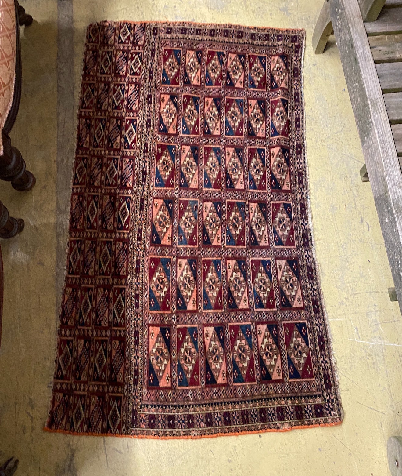 A Bokhara bagface rug, 122 x 69cm and four other rugs